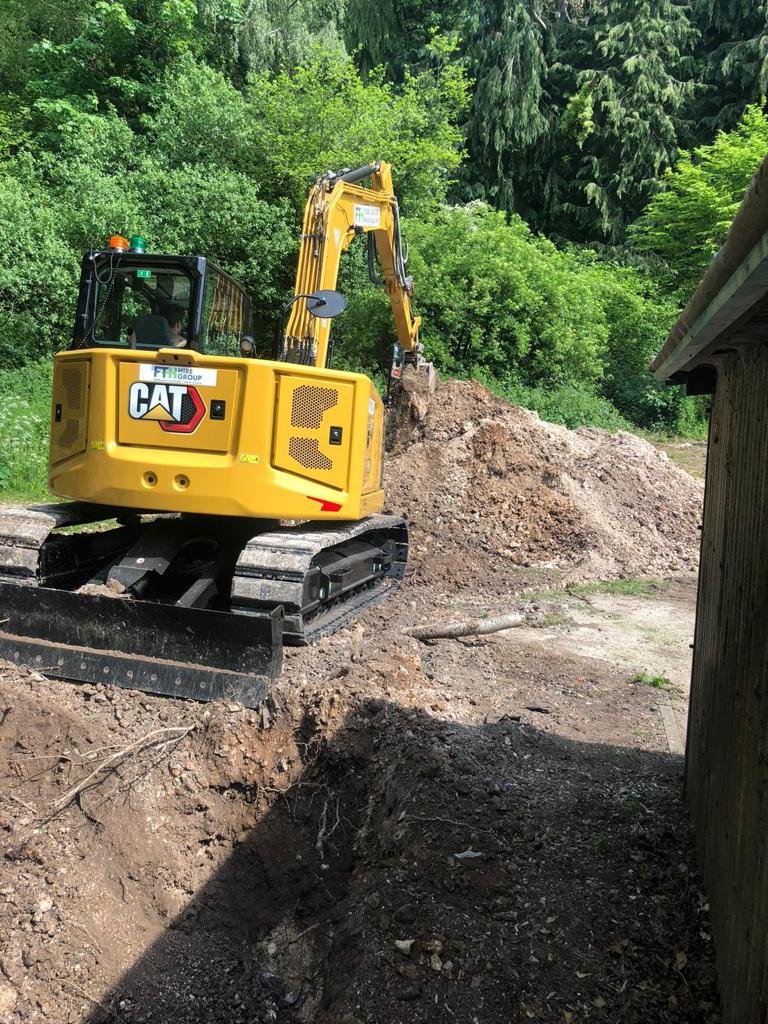 Excavator digging drainage